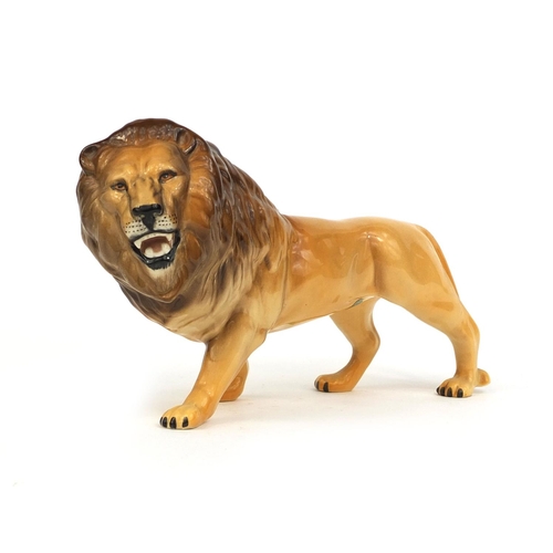 2101 - Beswick model lion, original paper label and factory marks to the base, 14cm high