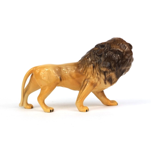 2101 - Beswick model lion, original paper label and factory marks to the base, 14cm high