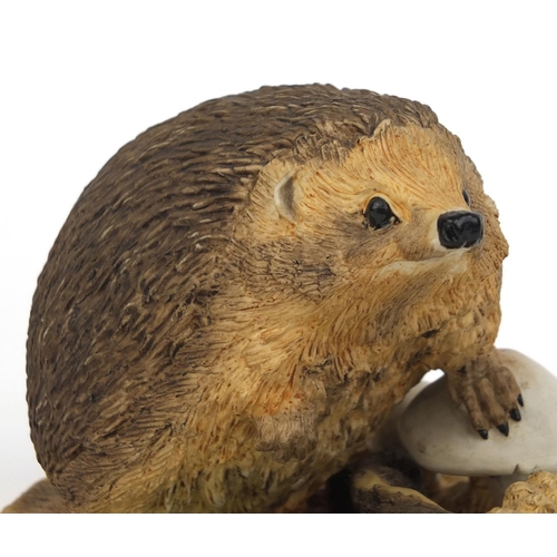 2083 - Wedgewood porcelain model of a hedgehog, together with a  Lladro bird, factory marks to the bases of... 