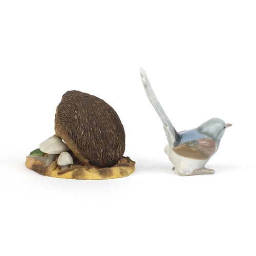 2083 - Wedgewood porcelain model of a hedgehog, together with a  Lladro bird, factory marks to the bases of... 