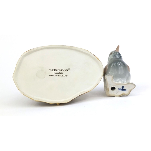 2083 - Wedgewood porcelain model of a hedgehog, together with a  Lladro bird, factory marks to the bases of... 