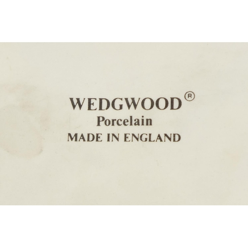 2083 - Wedgewood porcelain model of a hedgehog, together with a  Lladro bird, factory marks to the bases of... 