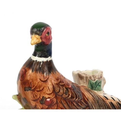 2107 - Pair of hand painted pheasant design candle holders, the largest 15cm high