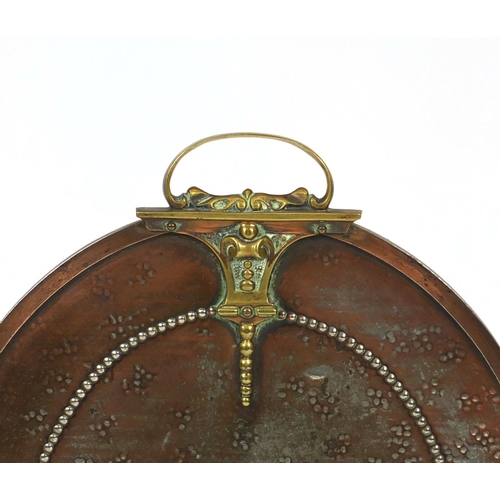 2059 - Copper and brass fire screen with brass handle and feet, 76cm high