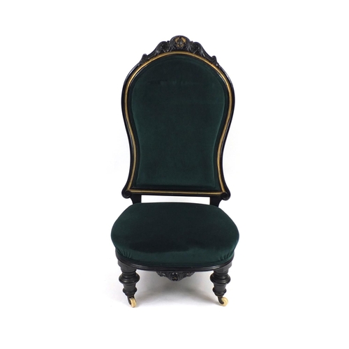 2023 - Victorian ebonised and gilt nursing chair with green upholstery, 107cm high