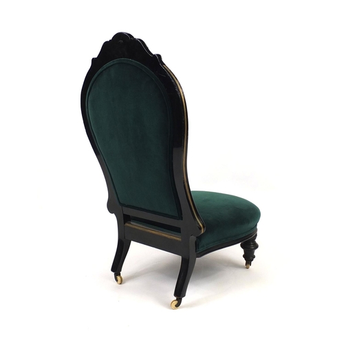 2023 - Victorian ebonised and gilt nursing chair with green upholstery, 107cm high