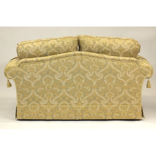 2013 - As new cream and gold upholstered two seater settee with cream and gold floral upholstered cushions,... 