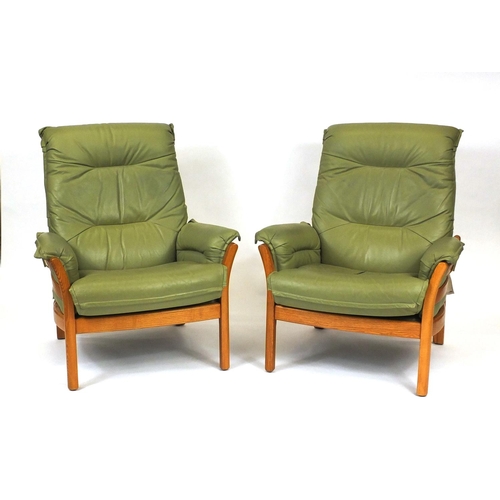 2009 - Ercol elm green leather upholstered seat comprising a three seater settee and two open armchairs, ea... 
