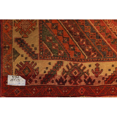2055 - Rectangular Persian Shiraz rug, the central field having an all over stylised design within four geo... 