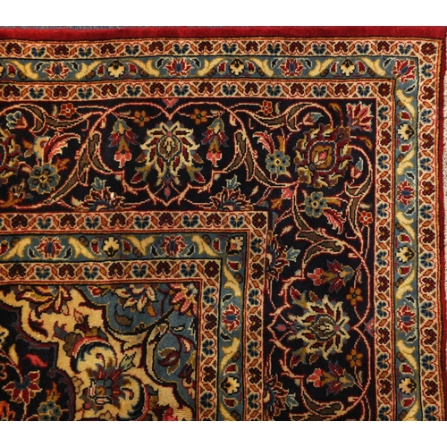 2003 - Rectangular Persian Meshed carpet, having an all over stylised floral design within foliate boarders... 