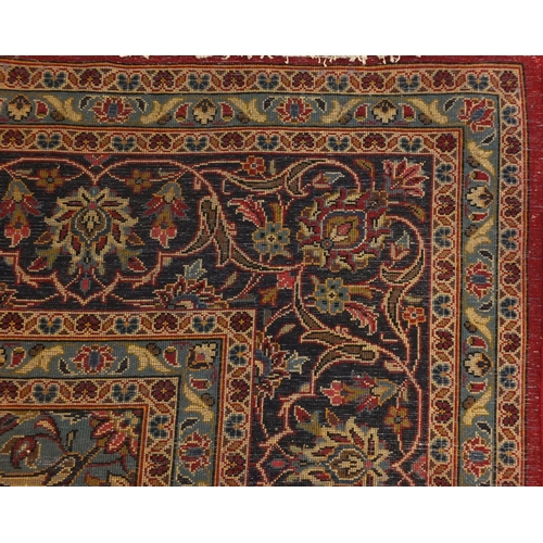 2003 - Rectangular Persian Meshed carpet, having an all over stylised floral design within foliate boarders... 