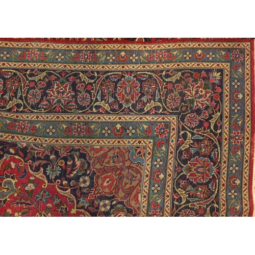 2020 - Rectangular Persian Meshed carpet, having an all over stylised floral design within foliate boarders... 