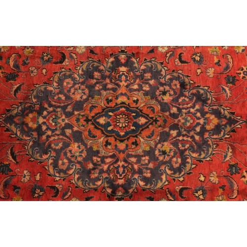 2028 - Rectangular Persian Meshed carpet, having an all over stylised floral design within foliate boarders... 