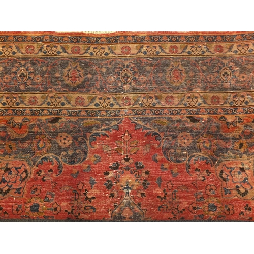 2028 - Rectangular Persian Meshed carpet, having an all over stylised floral design within foliate boarders... 