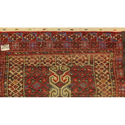 2052 - Rectangular Persian Baluchi rug, having an all over geometric design onto a red ground, 97cm x 81cm