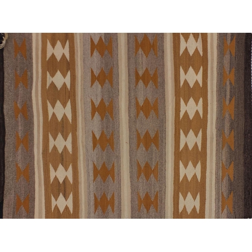 2042 - Rectangular Native American Navajo rug having an all over geometric design, 100cm x 74cm