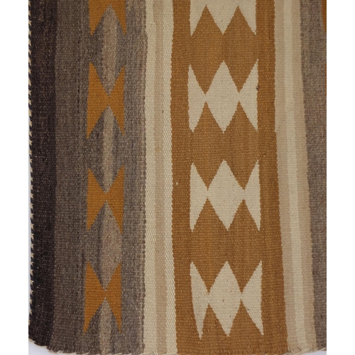 2042 - Rectangular Native American Navajo rug having an all over geometric design, 100cm x 74cm