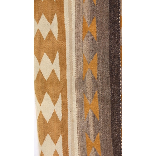 2042 - Rectangular Native American Navajo rug having an all over geometric design, 100cm x 74cm