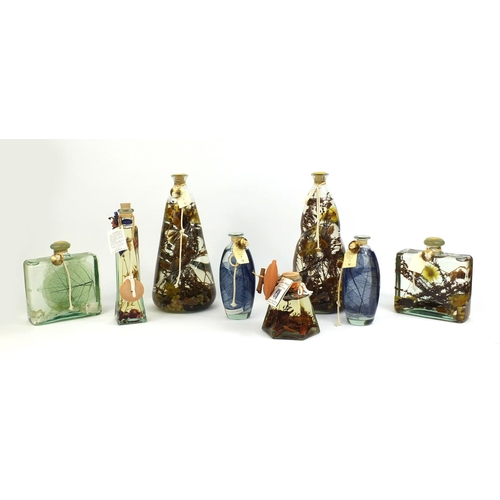 2237 - Collection of French perfume oil lamps including a large pair, some decorated with flowers to the in... 