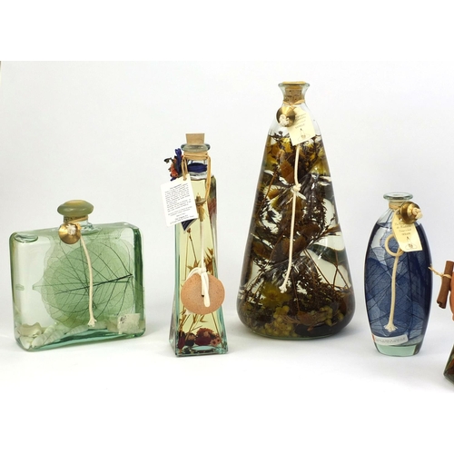 2237 - Collection of French perfume oil lamps including a large pair, some decorated with flowers to the in... 