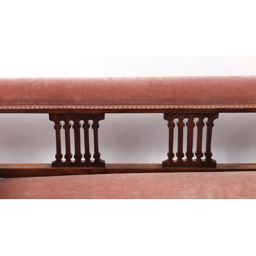 2030 - Walnut framed chaise lounge with salmon upholstery together with two matching carved salon chairs, t... 