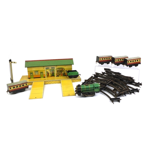 2344 - Group of Hornby O Gauge tinplate railway including locomotive 3402, carriages and book stall station