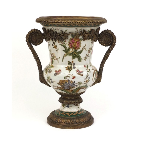 2127 - Twin handled urn shaped porcelain vase hand painted with flowers and foliage with stylised metal fit... 