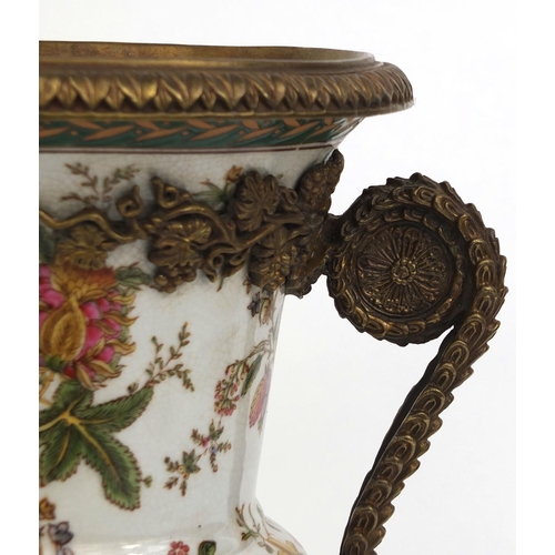 2127 - Twin handled urn shaped porcelain vase hand painted with flowers and foliage with stylised metal fit... 