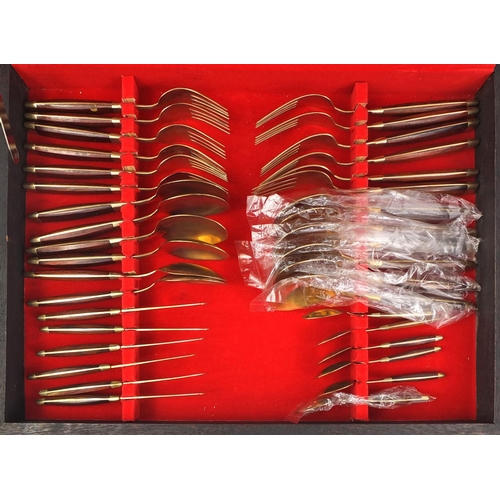 2289 - Twelve place canteen of wooden handled bronze cutlery, together with a case set of six similar butte... 