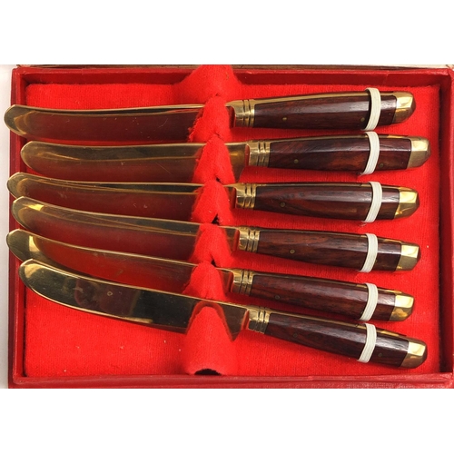 2289 - Twelve place canteen of wooden handled bronze cutlery, together with a case set of six similar butte... 