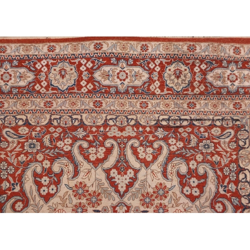 2012 - Good quality rectangular Kashmir silk rug, having an all over stylised floral design within foliate ... 