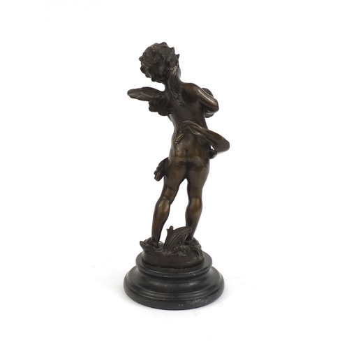 2208 - Bronze model of a fairy cupid raised on a faux marble base, 30c high