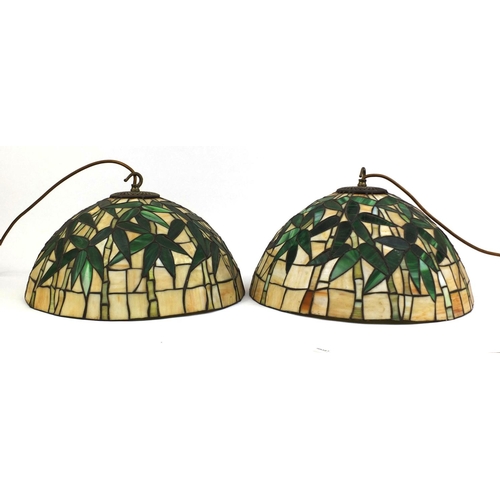 2160 - Pair of Tiffany & Co design leaded glass shades decorated with trees, each 40cm in diameter