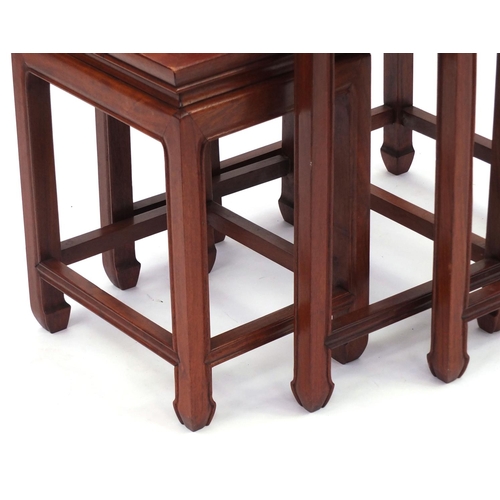 2044 - Nest of three Chinese and hardwood occasional tables, the largest 63cm high x 50cm wide x 38cm deep