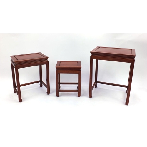 2044 - Nest of three Chinese and hardwood occasional tables, the largest 63cm high x 50cm wide x 38cm deep