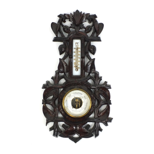 2255 - Black forest wall barometer thermometer carved with foliage, 47cm high