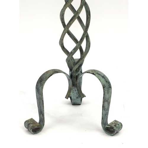 2310 - Wrought iron floor standing candle holder with hand decorated candle, 83cm high