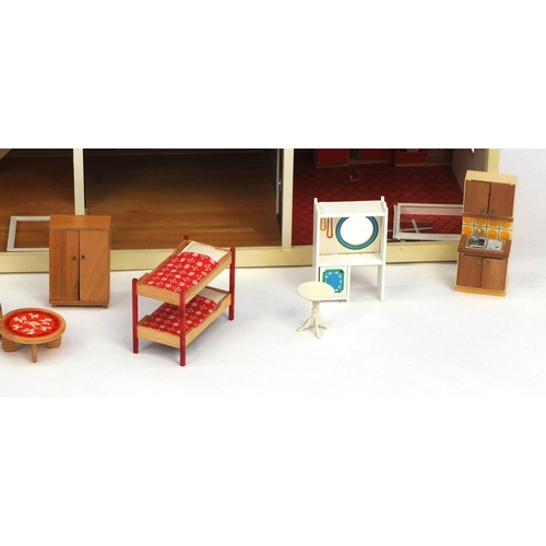 2349 - Swedish Lundby wooden and plastic dolls house with a large selection of boxed furniture, 88cm long