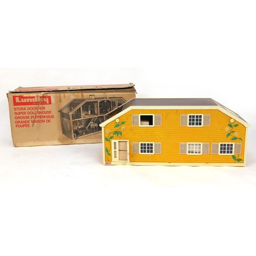 2349 - Swedish Lundby wooden and plastic dolls house with a large selection of boxed furniture, 88cm long