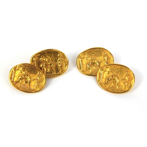 2632 - Pair of gilt metal cufflinks decorated with figures wrestling, approximate weight 6.5g