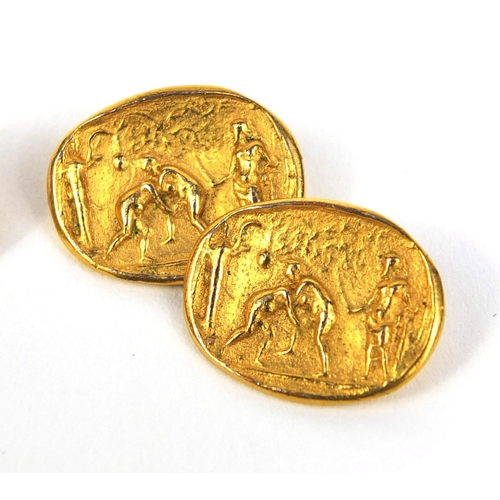 2632 - Pair of gilt metal cufflinks decorated with figures wrestling, approximate weight 6.5g