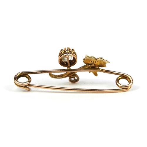 2631 - 9ct gold bar brooch set with seed pearls and a clear stone, 3.5cm long, approximate weight 1.4g