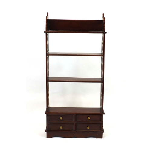 2029 - Mahogany four shelf open book rack with pierced sides and three drawers to the base, 110cm high x 52... 