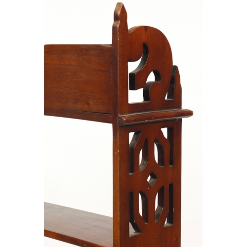 2029 - Mahogany four shelf open book rack with pierced sides and three drawers to the base, 110cm high x 52... 