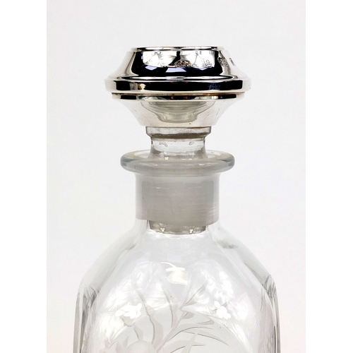 2130 - Two bottled Tantalus with silver stoppers and etched floral decoration, the stoppers hallmarked Birm... 