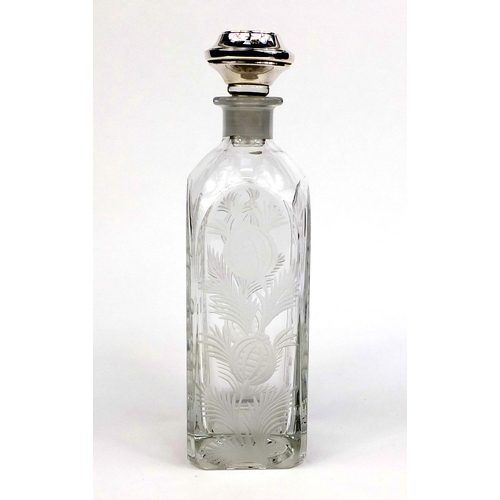 2130 - Two bottled Tantalus with silver stoppers and etched floral decoration, the stoppers hallmarked Birm... 