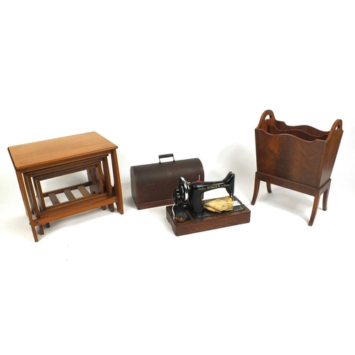 53 - Nest of three teak occasional tables, mahogany magazine rack and a cased Singer Sewing machine Model... 