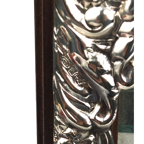 101 - Silver cornered wall hanging display case with glazed door and three glass shelves, the silver corne... 