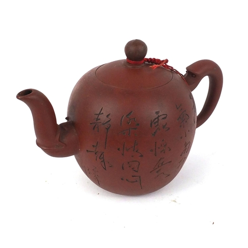 126 - Chinese Yixing terracotta teapot incised with script, 13cm high