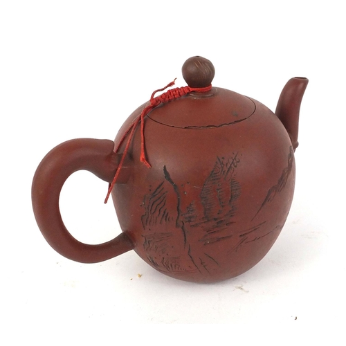 126 - Chinese Yixing terracotta teapot incised with script, 13cm high